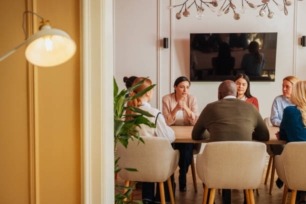 istock Group of employees sitting on a work meeting 2153358197