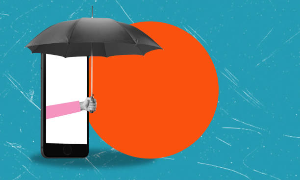 istock Digital Defense Smartphone with an umbrella against a bright orange circle. 2153358208
