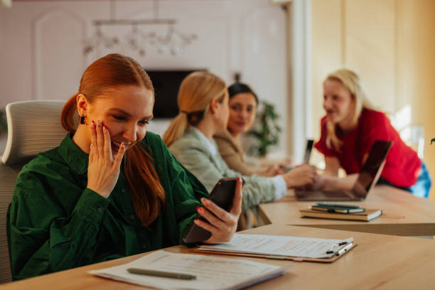 istock Female worker feeling excited while having a video call in the office 2153358306