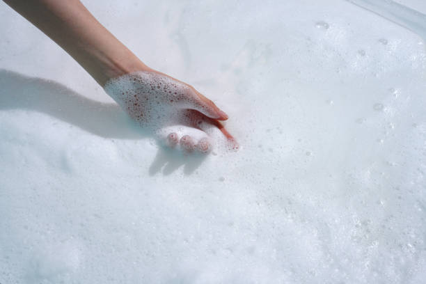 istock Foam texture and young Asian woman's hands 2153361941