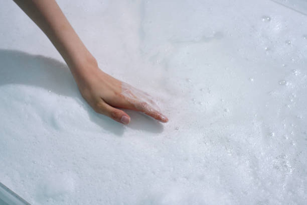istock Foam texture and young Asian woman's hands 2153361943