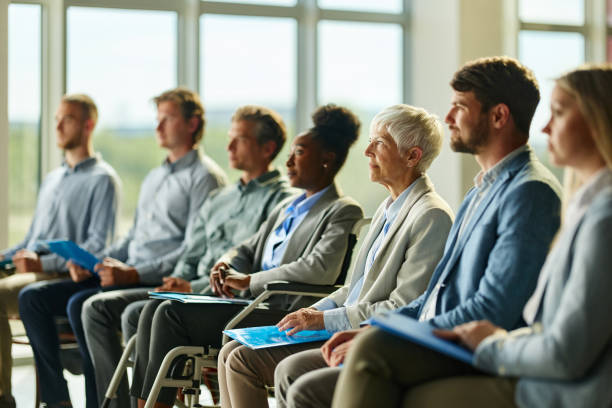 istock Business people attending a seminar in board room. 2153362013