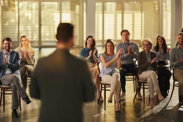 istock Happy entrepreneurs applauding on a seminar in board room. 2153362113