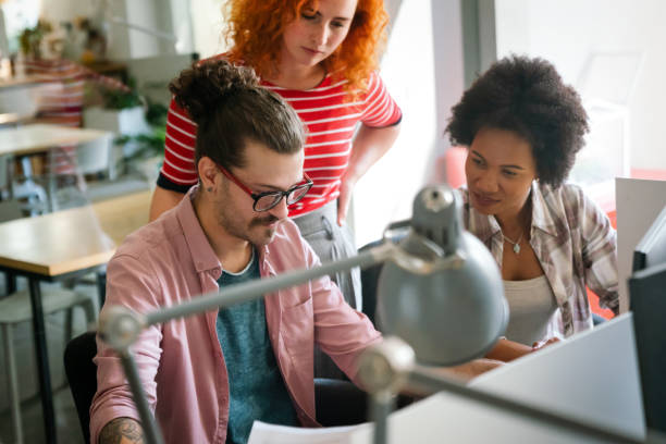 istock Group of business people and software developers working as a team in office 2153365341
