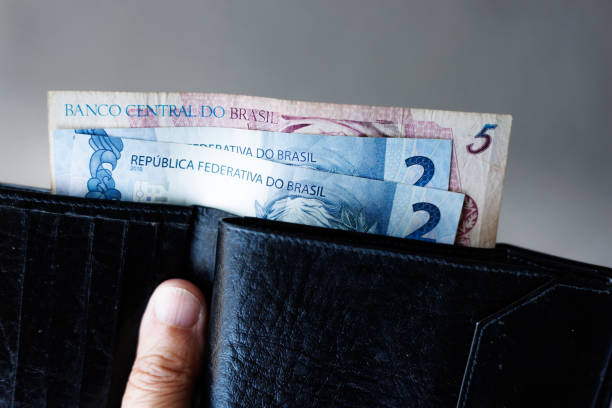 istock Brazilian Currency in Wallet 2153365555