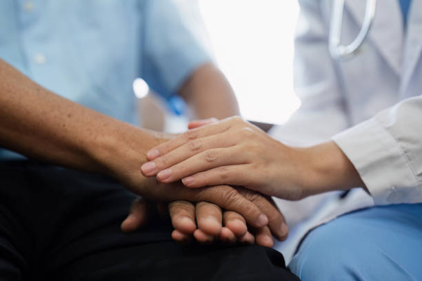 istock Doctors or nurses hold hands of elderly patients to support and soothe 2153365852