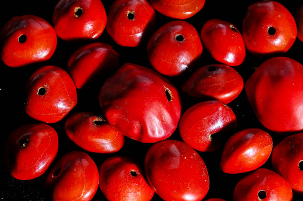 istock A close up of red fruit with a hole in the middle 2153365882