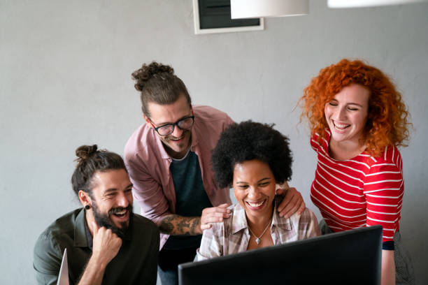istock Group of business people and software developers working as a team in office 2153365922