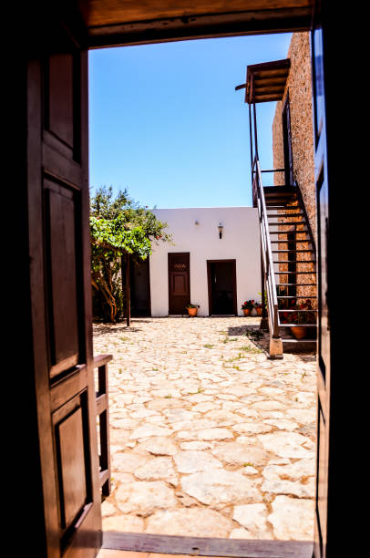 istock A large open door leads to a courtyard with a stone floor 2153365975