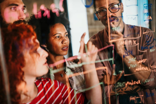 istock Group of business people and software developers working as a team in office 2153367092