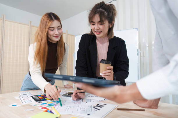 istock UI designer and UX developer brainstorm together. Creative digital development agency. UX UI concept 2153367189
