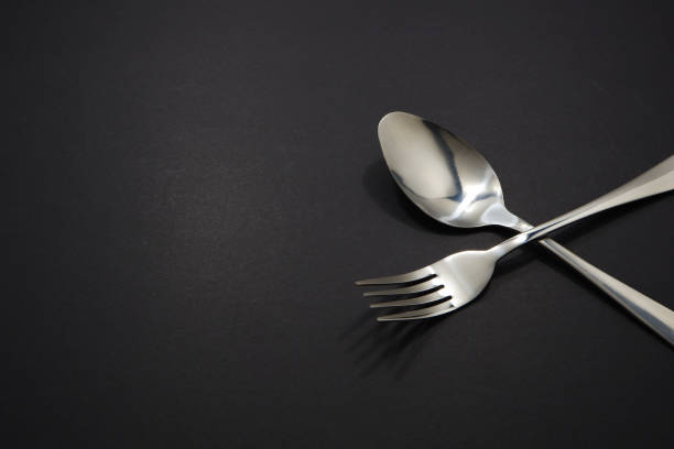 istock Cutlery set pairing together isolated on black background copy space 2153368112