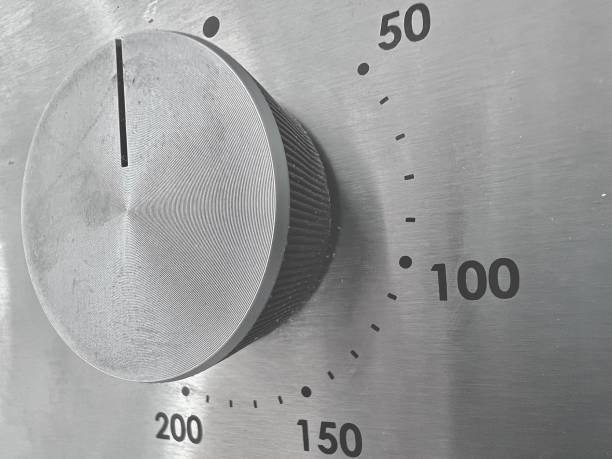 A temperature thermostat dial on a conventional electric oven