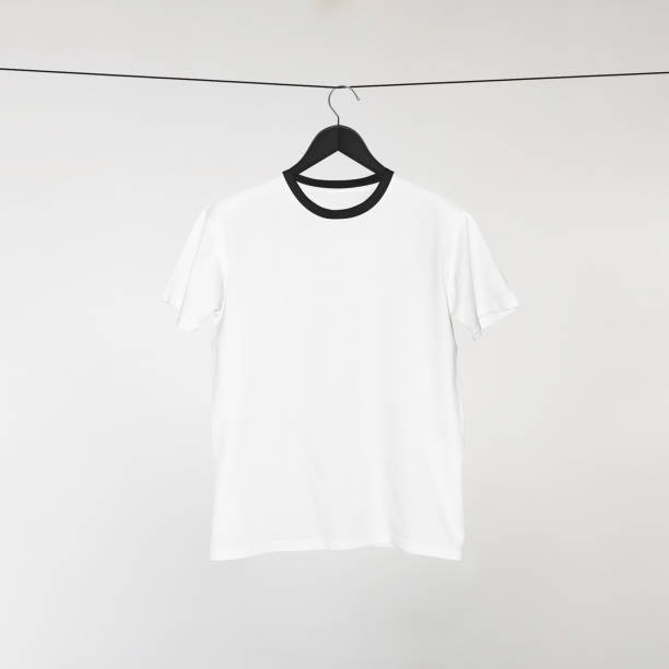 istock Blank White T-Shirts Mockup Hanging on Grey Wall: 3D Rendering 2153370984