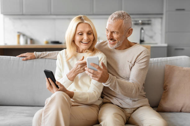 istock Happy senior couple using smartphone 2153371017
