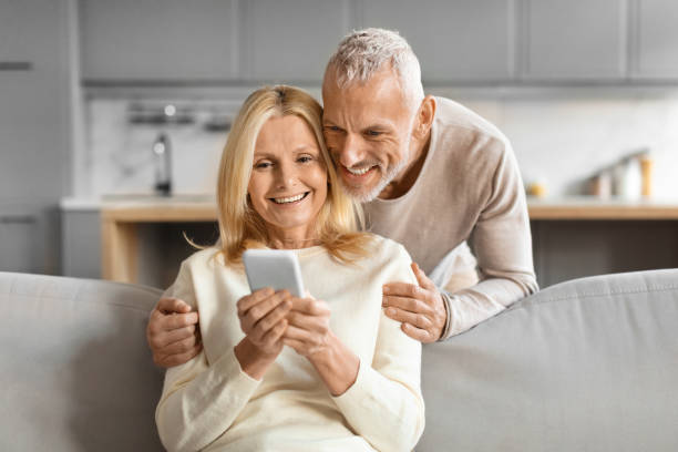 istock Elderly couple interacting with a smartphone 2153371049