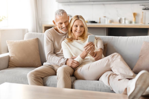 Mature couple enjoying a smartphone together