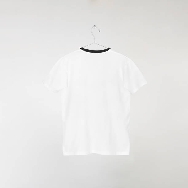 istock Blank White T-Shirts Mockup Hanging on Grey Wall: 3D Rendering 2153371429