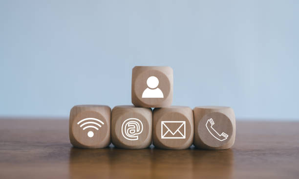 istock Customer support hotline Contact us people connection.Website page contact us or e-mail marketing concept,  Chat message icons. address,call phone, address, Label wood with the email. 2153372513