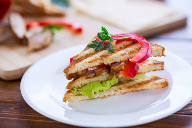 istock fried toast with chicken, salad, greens on a wooden table 2153374535