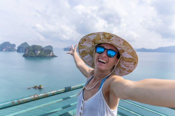 istock Woman Taking A Celebratory Scenic Selfie 2153376228