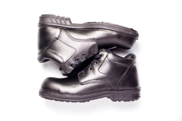 a covering for the foot, typically made of leather, having a sturdy sole and not reaching above the ankle