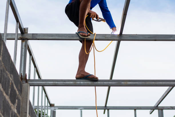 istock Home roof frame welder. concept working at unsafe height. 2153380250