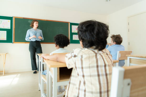 Junior-high Black students attend a math class at school.  They participate in math lesson and solve math problems.
