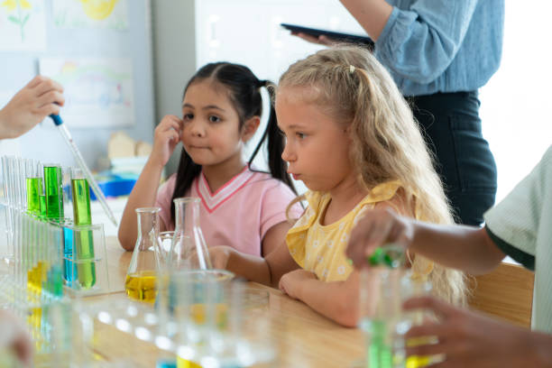 istock Teacher and students, Learn and experiment with science in a school science classroom. 2153382759
