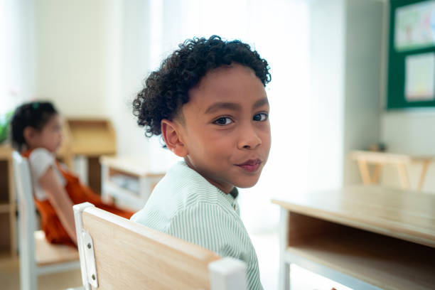 istock Teacher and students, Learn and study in a classroom of school where youngsters sit and listen attentively. 2153382865