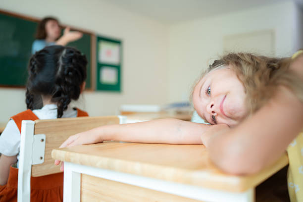 istock When class becomes dull. The kids started to feel tired and sleepy. 2153382874