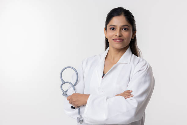 istock Confident female doctor on white background 2153384563