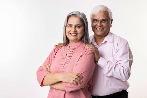 istock Portrait of loving senior couple over white background 2153385196