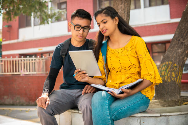 istock Multiethnic college student friends studying together at campus. 2153386008