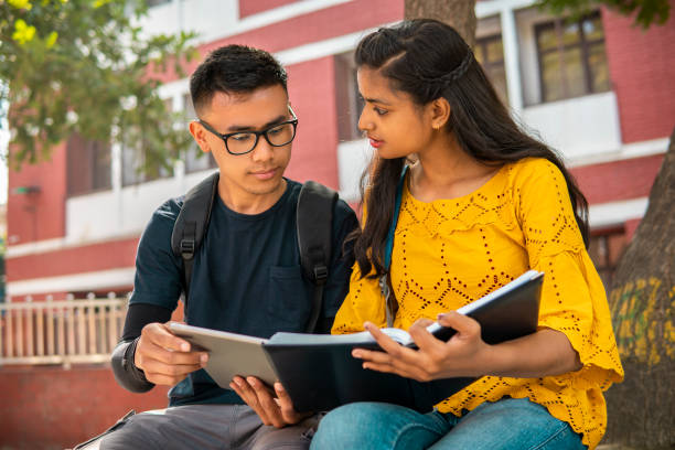 istock Multiethnic college student friends studying together at campus. 2153386044