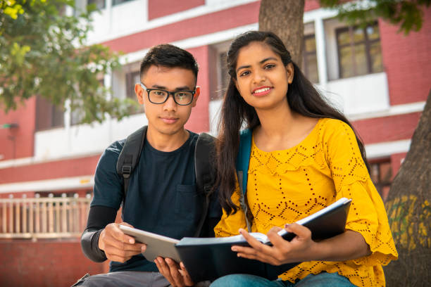istock Multiethnic college student friends studying together at campus. 2153386552
