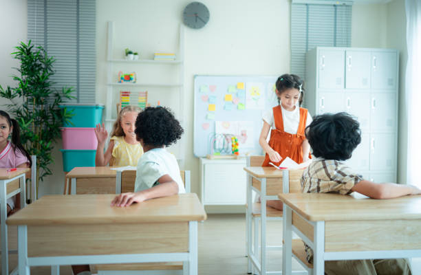 istock Students learn and study in a classroom of school where youngsters sit and listen attentively. 2153389114
