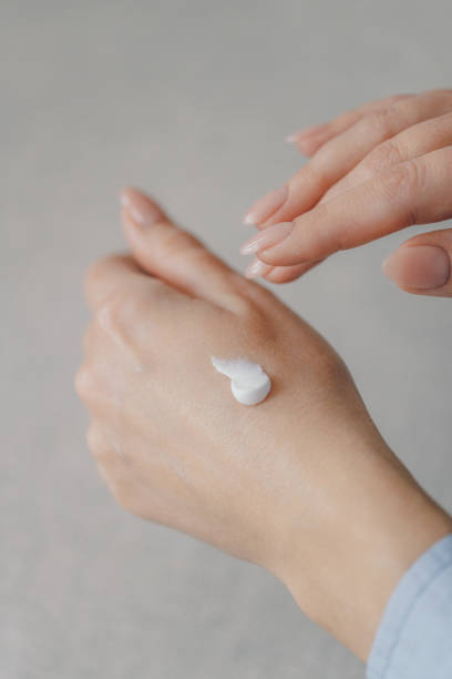 istock Woman applying hand cream 2153389865