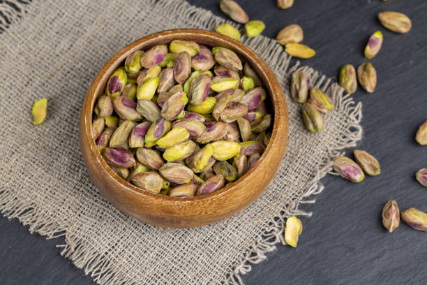 istock delicious salted green pistachios without shells 2153390689