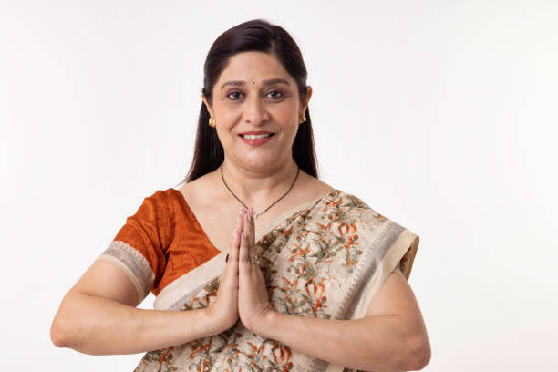 istock Indian woman in sari greeting with prayer pose 2153392263