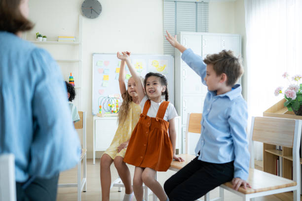 istock Teacher and students, Learn and study in a classroom of school where youngsters sit and listen attentively. 2153392930