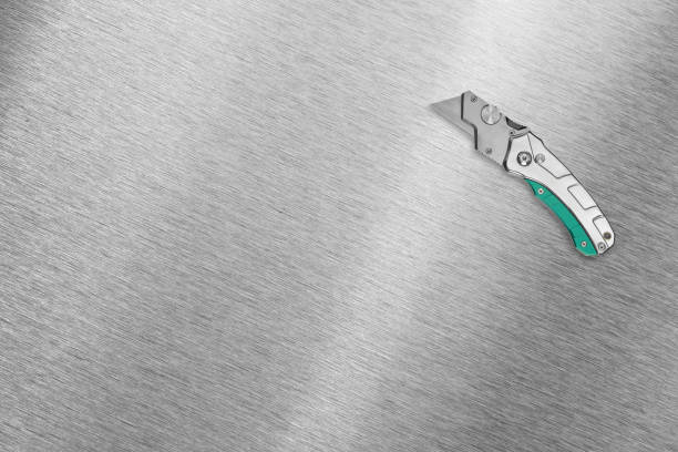 Metal industrial utility knife on a background