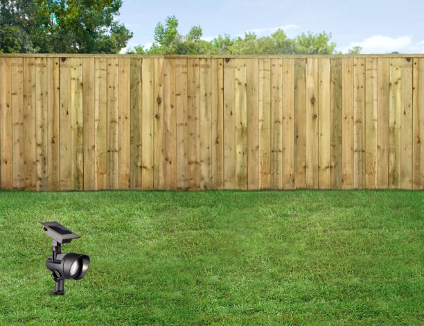 istock Solar powered lawn light in a background with a fence 2153393768