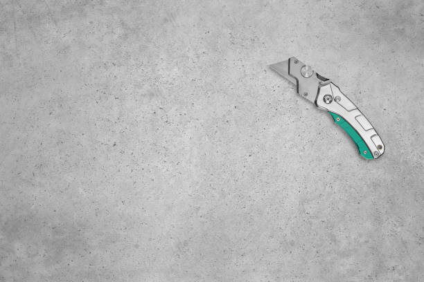 Metal industrial utility knife on a background