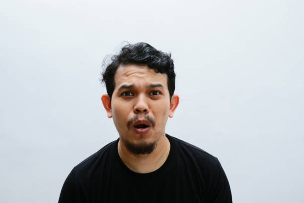 istock portrait shocked expression of asian man 2153398411