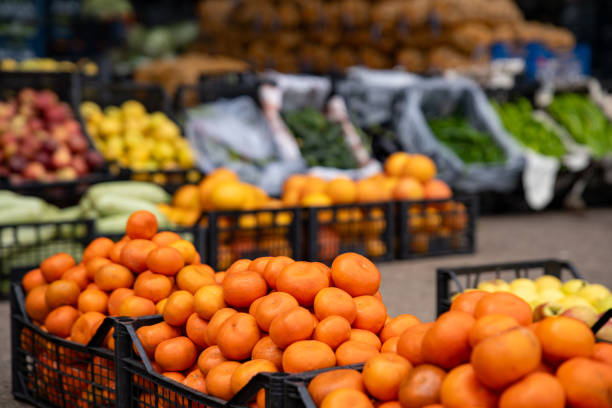istock Mandarins in the plastic crate at the market. 2153398438
