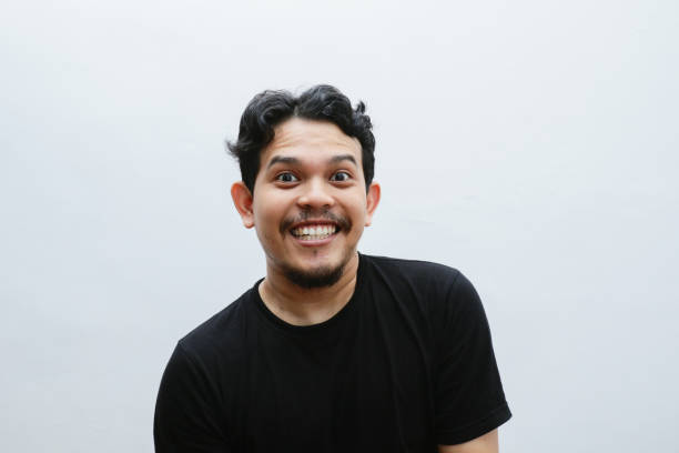 istock an asian man smiles and laughs 2153399266