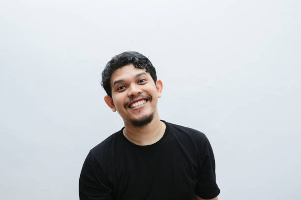 istock an asian man smiles and laughs 2153399267