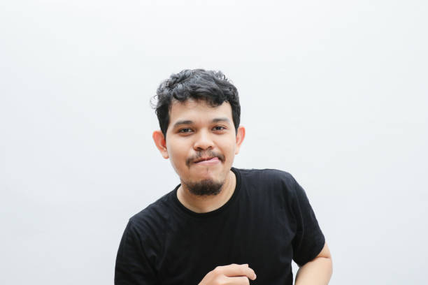 istock a smiling asian man with a funny face 2153399531