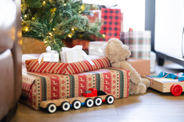 istock Low angle view presents and toys on Christmas morning 2153399695